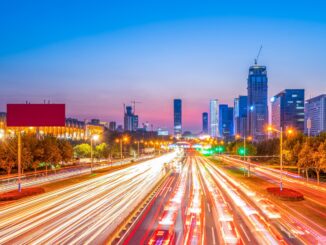 Vehicle lights on an urban road in Jinan, China.