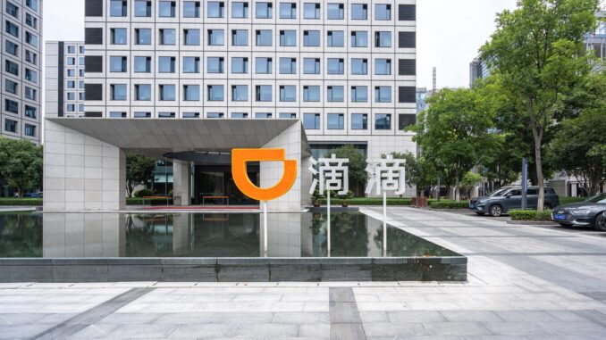 China's Didi Chuxing Debuts Digital Yuan Services The Didi logo outside an office in China.