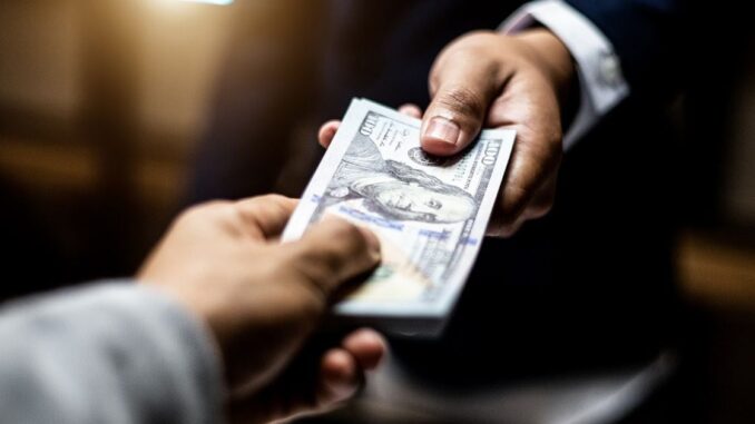How Tokenized Assets Can Replace Money New York Stock Exchange with banner flagging ProShares Bitcoin Strategy ETF on the day it started trading.