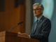 Federal Reserve Chair Jerome Powell delivering a statement at a news conference.