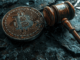 Image depicting Bitcoin with a gavel, symbolizing the US government's handling of seized cryptocurrency.